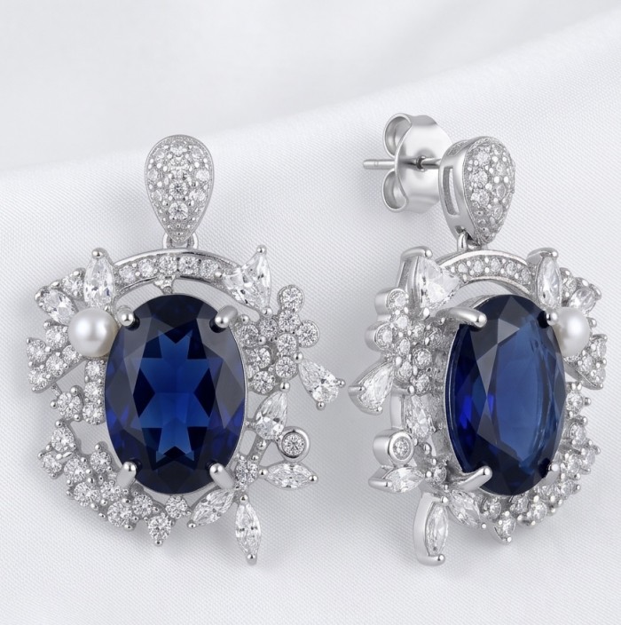 Vintage style - Giovanna - oval pear cut 7.9 carat Sapphire .925 Sterling Silver handcrafted earrings - Close-up of vintage-style earrings with blue sapphire and diamond accents.
