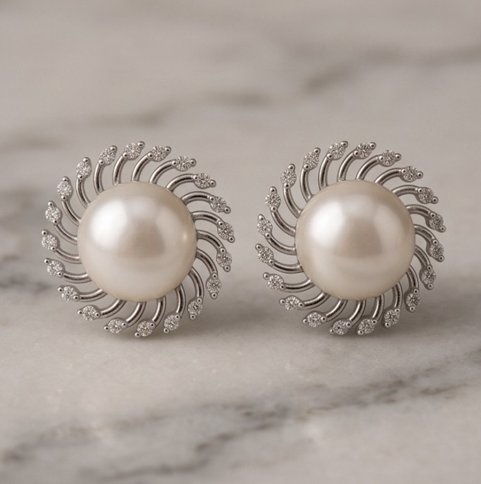 Genuine Pearl .925 Sterling Silver dipped in rhodium handcrafted Statement Earrings - Front view of pearl earrings with sterling silver sunburst design