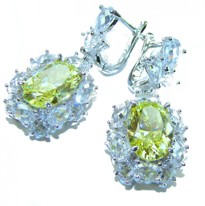 Luxurious 10.5 carat Golden - yellow Montana Sapphire .925 Sterling Silver handcrafted earrings - Close-up of luxury golden-yellow Montana Sapphire earrings.