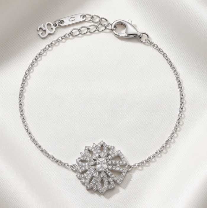 Isabella authentic 10.2 carat White Topaz .925 Sterling Silver handcrafted Statement Bracelet - Bracelet with starburst design on satin fabric, top view