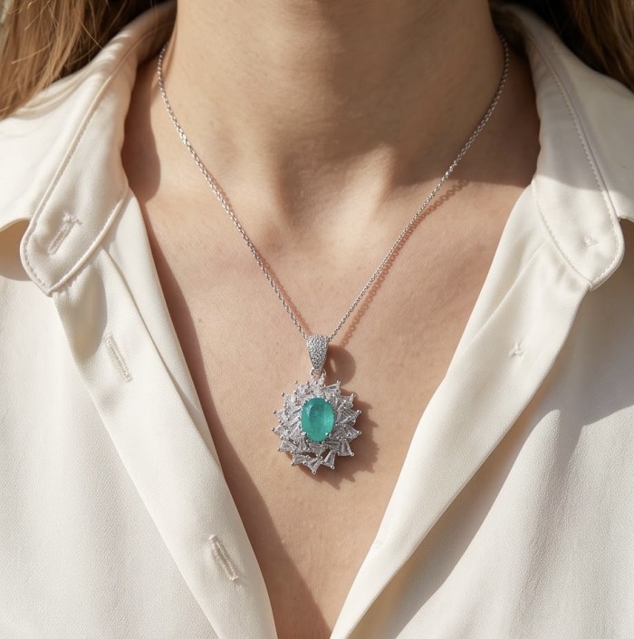 Isabella 3.2 carat oval cut Emerald .925 Sterling Silver Perfectly handcrafted pendant - Emerald pendant in sterling silver worn on neck with open-collar shirt.