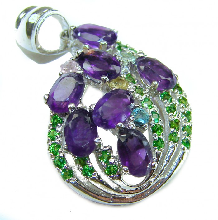 Mademoiselle - 14.2 carat Amethyst .925 Sterling Silver handcrafted Pendant - Amethyst pendant on sterling silver with green accents, top view.