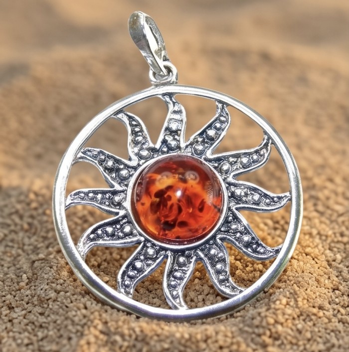 Bright Sun Baltic Polish Amber 14k Gold over .925 Sterling Silver handcrafted Pendant - Sun-shaped pendant with amber center on sand background, front view.