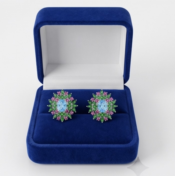 Exquisite 24.7 carat Swiss Blue Topaz rhodium over .925 Sterling Silver Handcrafted Statement earrings - Front view of Swiss Blue Topaz earrings in a blue velvet box
