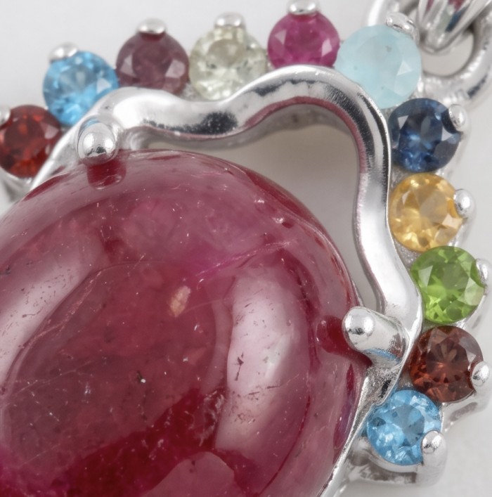 Authentic 6.5 CARAT Ruby .925 Sterling Silver Pendant - Close-up of ruby and multicolored gem sterling silver pendant.