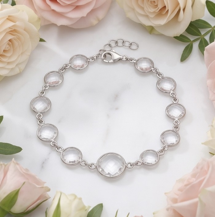 Authentic 22.5 carat Brazilian Rose Quartz .925 Sterling Silver handmade Bracelet - Bracelet on marble with pink roses, showcasing Brazilian rose quartz stones