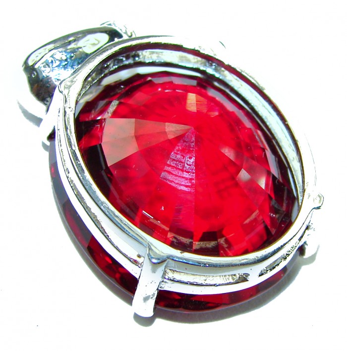 Bella Rosa oval cut 32.5 carat Red Topaz .925 Sterling Silver handmade Pendant - Close-up of Bella Rosa oval cut 32.5 carat red topaz in sterling silver.