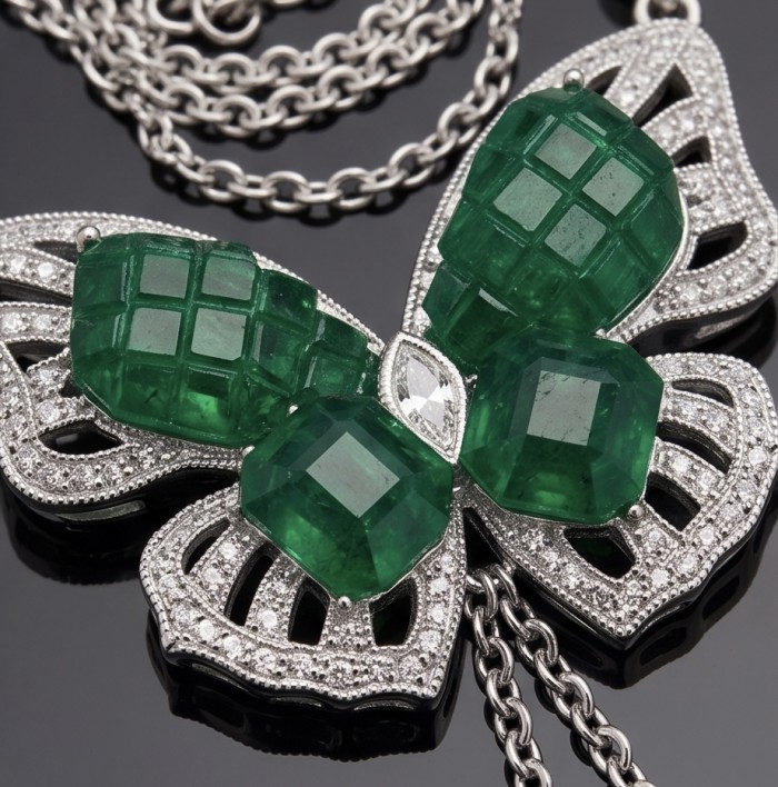 Precious Butterfly authentic mystery setting 12.9 carat Colombian Emerald .925 Sterling Silver handcrafted Statement necklace - Butterfly necklace with emeralds and diamonds, close-up view.