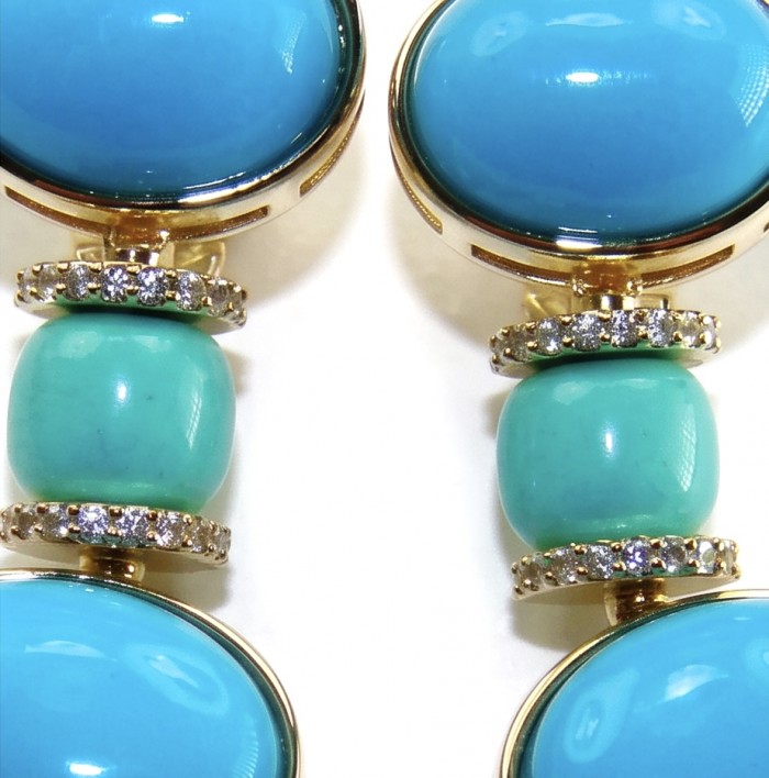 Pacifica - 35.4 carat Sleeping Beauty Turquoise 18K Gold .925 Sterling Silver handmade Statement Earrings - Close-up of turquoise and gold jewelry with gemstone accents.
