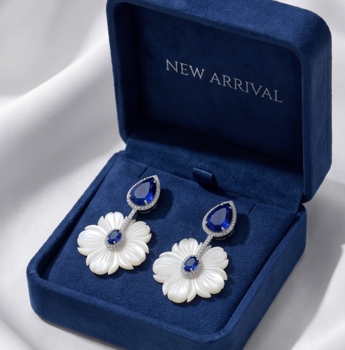 Summer Flowers Blister Pearl Blue Topaz 14K Gold over .925 Sterling Silver handcrafted Earrings - Earrings in case, front view; pearl flower with blue topaz accents.