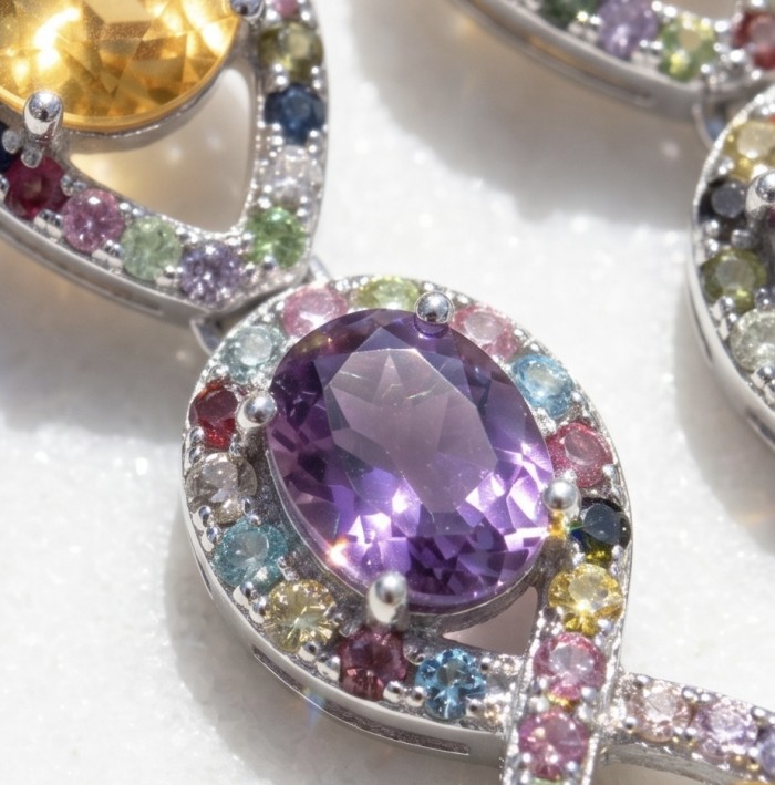 Exclusive 14.5 carat Brazilian Citine rhodium over .925 Sterling Silver handcrafted Earrings - Close-up of colorful gemstone jewelry with citrine and amethyst.