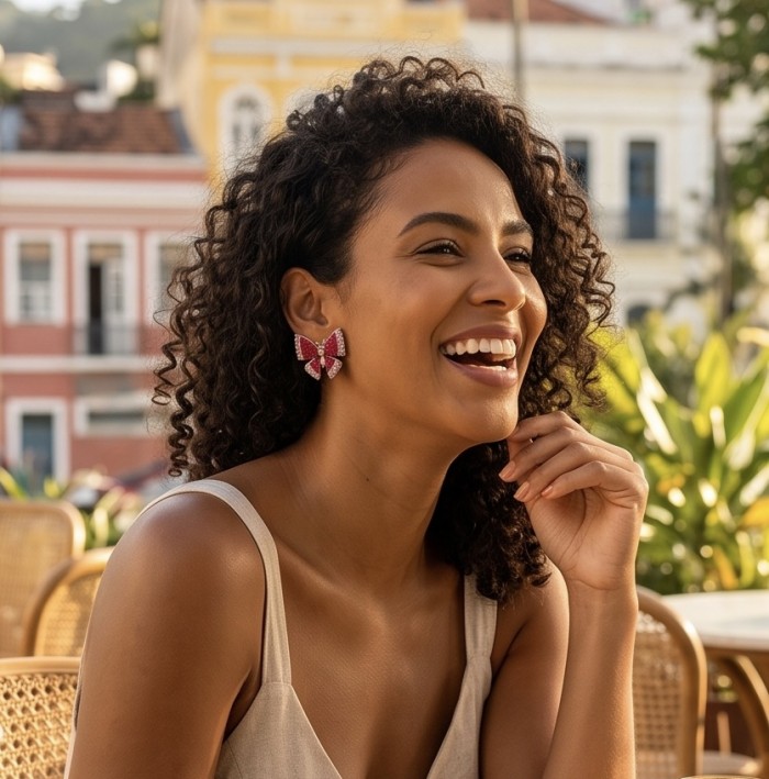 Natural 18.2 carat mystery setting Ruby Butterflies .925 Sterling Silver handcrafted earrings - Woman wearing butterfly earrings, side view.