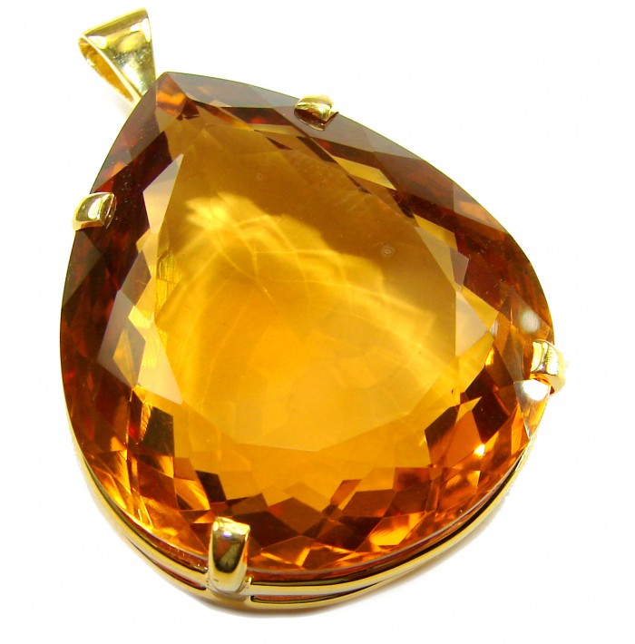Luxury genuine 53.5 CARAT pear cut Champagne Topaz .925 Sterling Silver dipped in 18K Gold handmade Pendant - Close-up of a pear-cut Champagne Topaz pendant in gold setting.