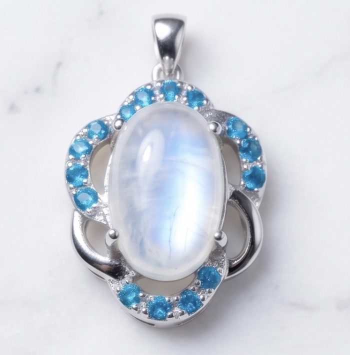Genuine 7.2 carat Fire Moonstone .925 Sterling Silver handcrafted pendant - Close-up of moonstone and turquoise pendant in sterling silver.