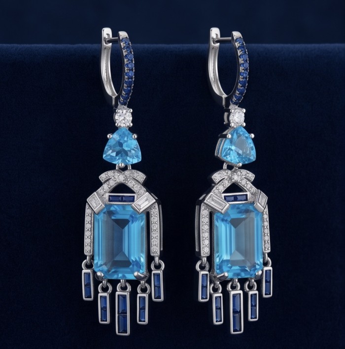 Atlantica - Art Deco- 10.7 carat Swiss Blue Topaz 0.8 CARAT Sapphire .925 Sterling Silver dipped in Rhodium Handcrafted Statement earrings - Art Deco earrings with Swiss Blue Topaz, front view on blue background