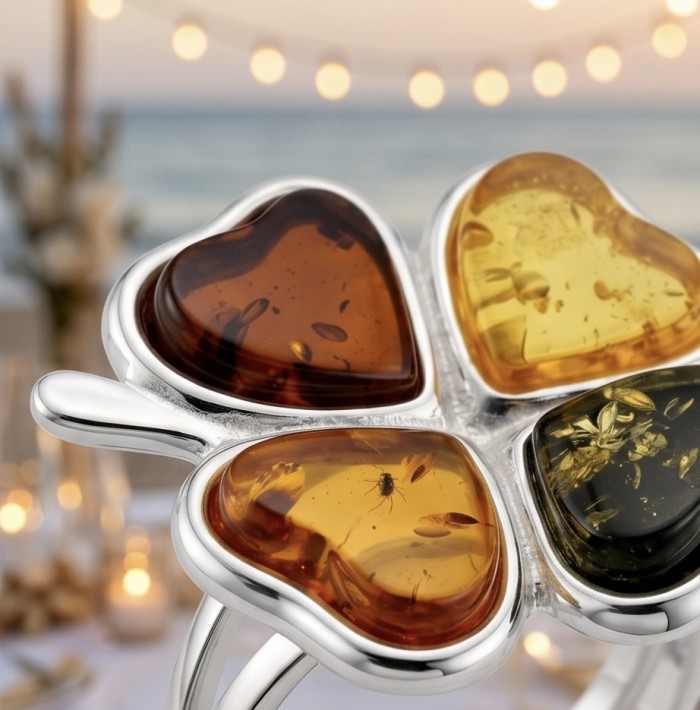 Flower Authentic Baltic Amber .925 Sterling Silver dipped in rhodium handcrafted ring; s. 8 adjustable - Close-up of a flower-shaped Baltic amber and sterling silver jewelry.