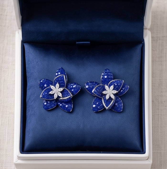 Born to Glam authentic mystery setting 18.2 carat Colombian Sapphire .925 Sterling Silver handcrafted earrings - Floral earrings in blue gem setting, front view in display box.