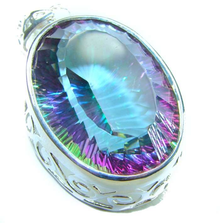 Blue Wonderland 49.7 carat oval cut Mystic Aurora Topaz .925 Sterling Silver handcrafted Pendant - Close-up of Blue Wonderland Mystic Aurora Topaz in silver setting