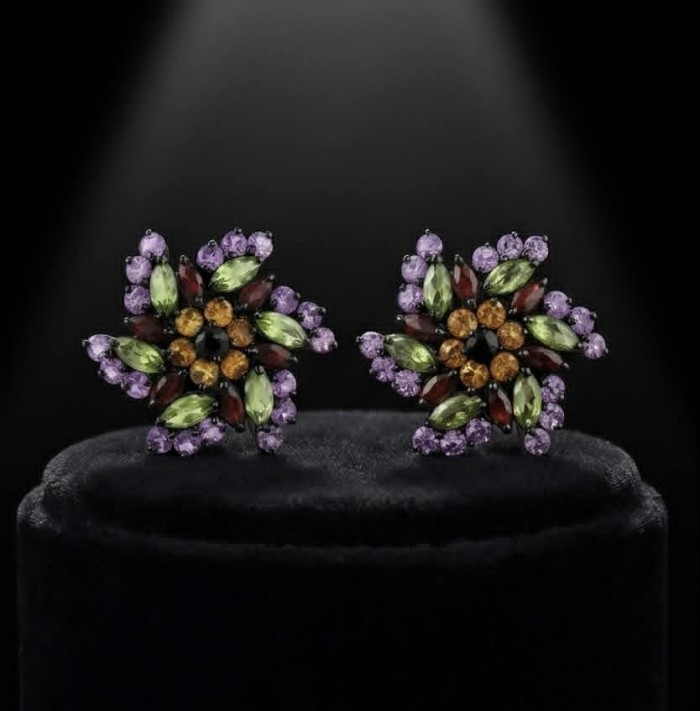 Serenity - Authentic 10.5 carat Multigem black rhodium over .925 Sterling Silver handcrafted earrings - Top view of Serenity multigem earrings on black velvet display.