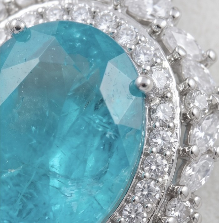 Wonderland 12.8 carat classic oval cut Paraiba Tourmaline Moissanite .925 Sterling Silver Handcrafted Statement necklace - Close-up of a 12.8 carat Paraiba Tourmaline oval cut with diamonds.