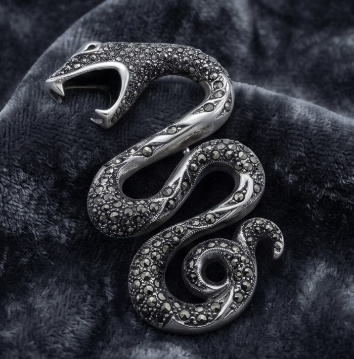 Divine Fire - Large 2 5/8 inches long Cobra Snake genuine Marcasite .925 Sterling Silver handmade Pendant - Snake-shaped jewelry with black stones on soft fabric background.