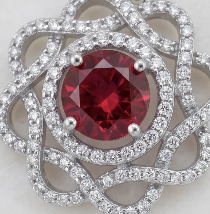 Exquisite 3.4 ctw Ruby .925 Sterling Silver handcrafted Statement earrings - Ruby stone close-up in intricate sterling silver setting.