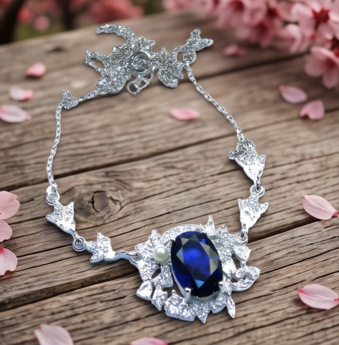 Vintage style - Giovanna - oval pear cut 6.8 carat Sapphire .925 Sterling Silver handcrafted Statement Necklace - Vintage necklace with sapphire on wooden surface with petals