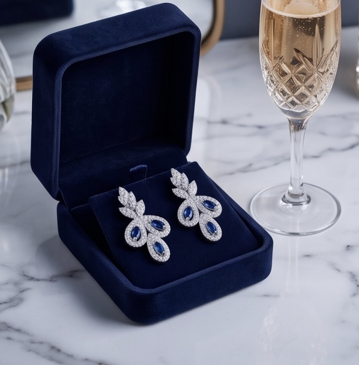 Blue Royalty - art deco - 3.7 carat Sapphire .925 Sterling Silver handcrafted Statement earrings - Elegant earrings in blue velvet box with champagne, top view.