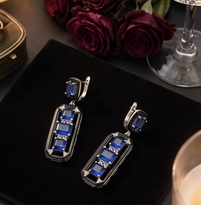Art Deco 11.5 carat Sapphire black enamel .925 Sterling Silver handcrafted earrings - Art Deco sapphire earrings on display with roses and glass nearby