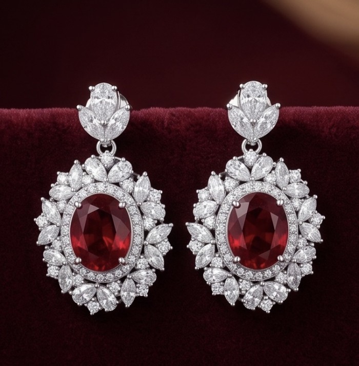 Exquisite 7.4 ctw Mozambique Ruby .925 Sterling Silver dipped in rhodium handcrafted Statement earrings - Front view of exquisite ruby earrings with sterling silver setting.