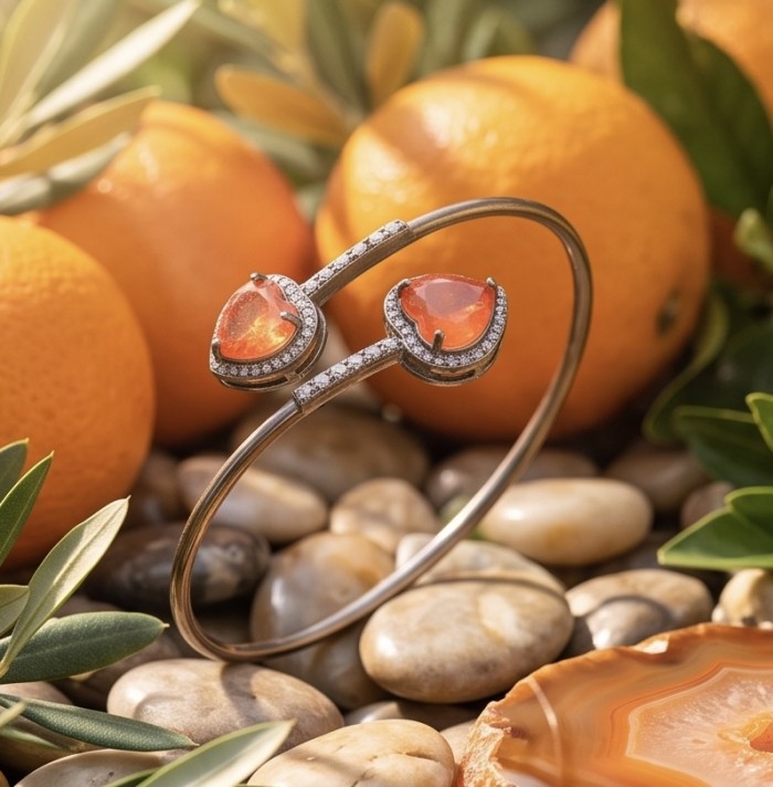 Two Hearts 10.8 carat White Topaz black rhodium over .925 Sterling Silver highly polished bracelet - Bracelet with orange stones and topaz, surrounded by oranges and leaves.