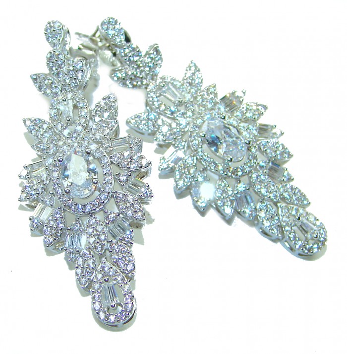 LUXURIUS 12.2 carat White Topaz .925 Sterling Silver handcrafted earrings - Ornate earrings with white topaz and silver, top view.