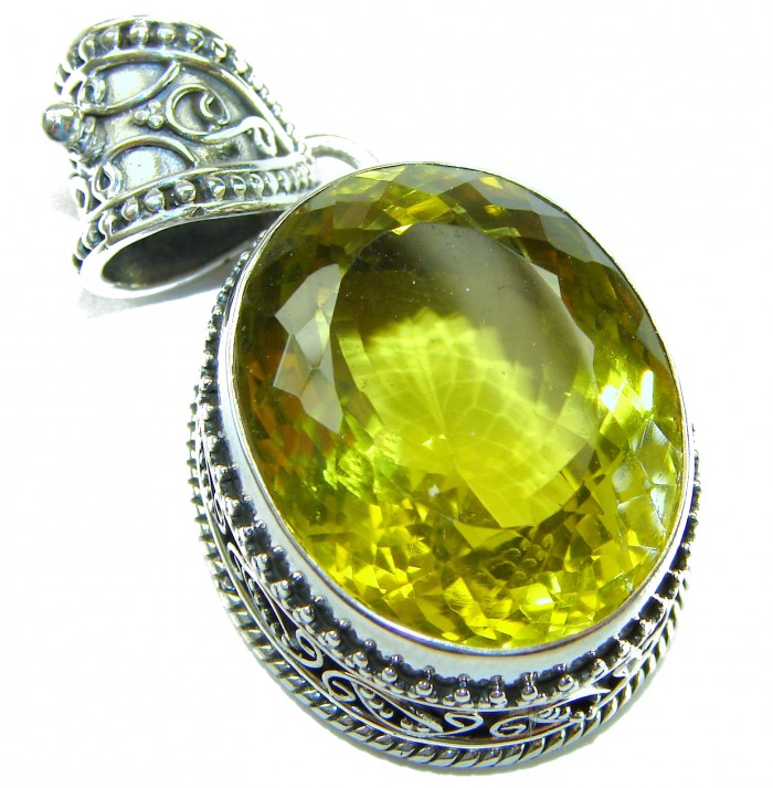 Perfection Oval cut 45.3 carat Lemon Quartz .925 Sterling Silver handcrafted LARGE pendant - Close-up of oval-cut lemon quartz pendant with ornate silver setting.