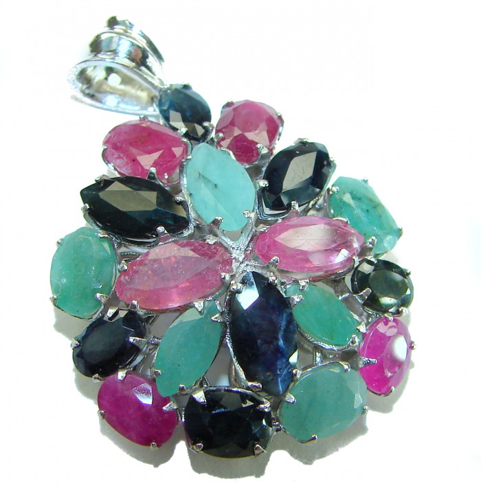 aUTHENTIC Red Ruby Emerald Sapphire 24.5 carat .925 Sterling Silver handmade Pendant - Close-up of multicolored gemstone pendant with silver setting