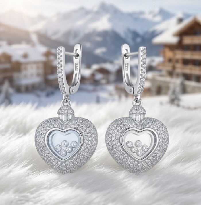 Precious Heart - Floating Memories 12.5 carat White Sapphire .925 Sterling Silver Handcrafted Statement earrings - Close-up of heart-shaped white sapphire earrings in snowy backdrop