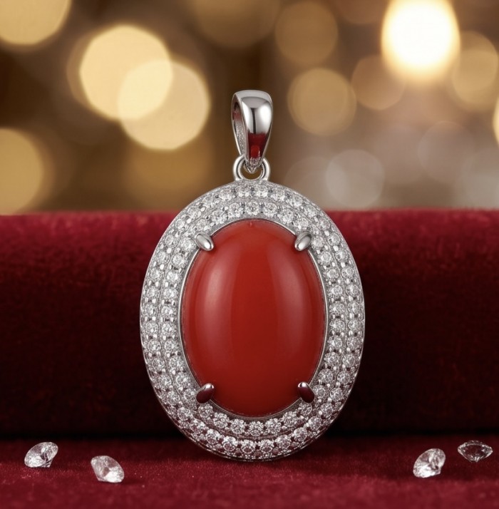 Elizabeth Natural Fossilized Coral .925 Sterling Silver handmade pendant - Red coral pendant with diamonds, front view, on red velvet background.