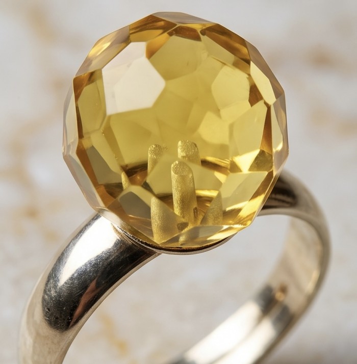 Modern Concept Golden Sphere - Natural faceted Baltic Amber 18K Gold over .925 Sterling Silver ring s. 8 - Close-up of faceted Baltic Amber ring on marble background