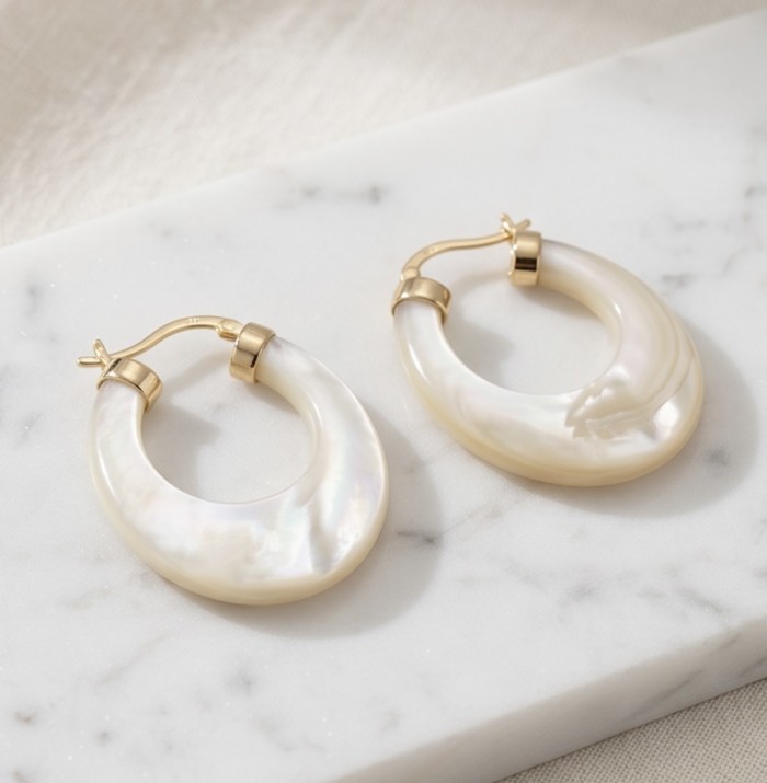 Sublime rainbow Blister Pearl 18K Gold over .925 Sterling Silver handcrafted Earrings - Blister pearl hoop earrings on marble, top view.