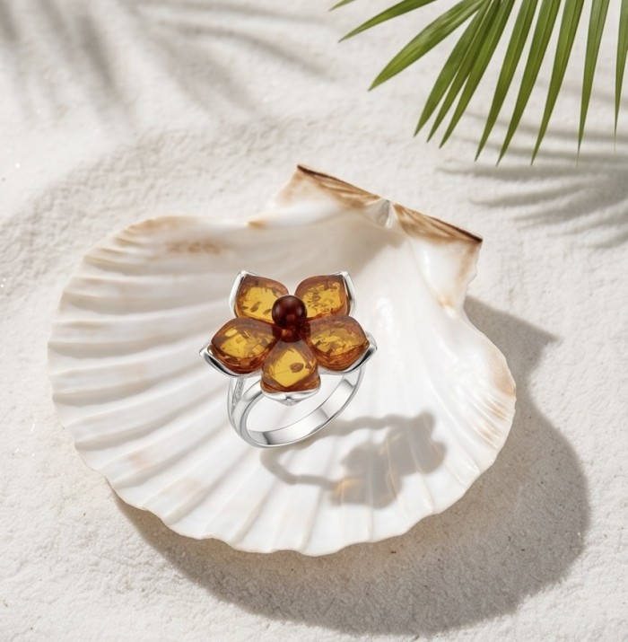 Golden Flower Authentic Baltic Amber rhodium over .925 Sterling Silver handcrafted ring; s. 7 adjustable - Golden Flower Baltic Amber ring on shell, top view, beach setting.