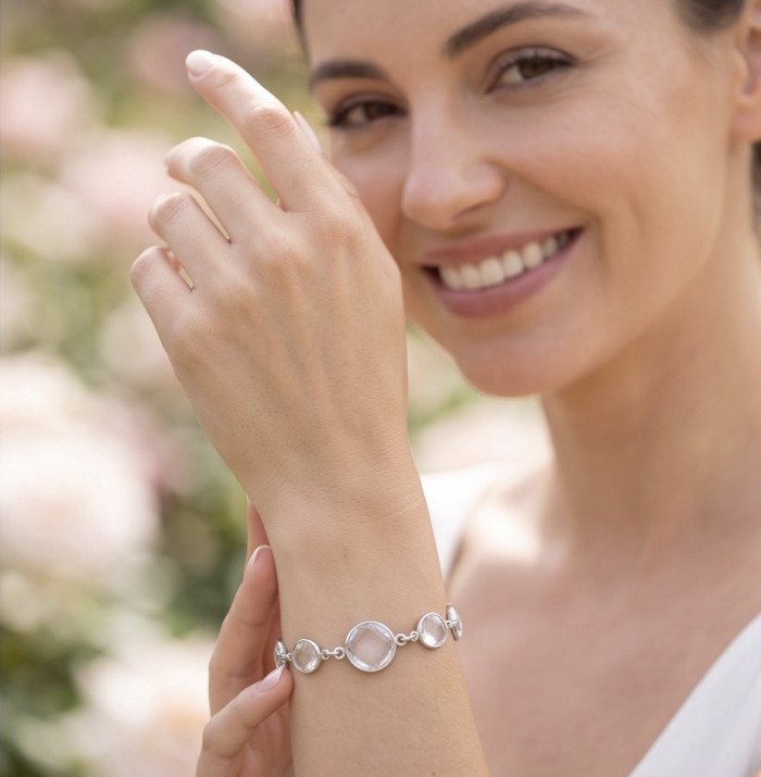 Authentic 22.5 carat Brazilian Rose Quartz .925 Sterling Silver handmade Bracelet - Woman wearing 22.5 ct Brazilian Rose Quartz bracelet on wrist close-up