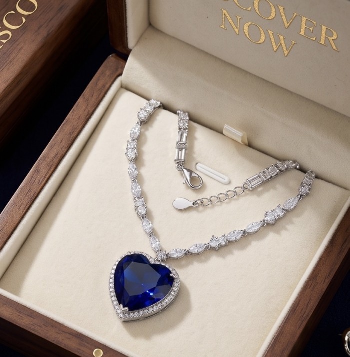 Titanic - Heart of The Ocean Necklace ~ 24.5 Ct Blue Sapphire Necklace In 925 Sterling Silver necklace - Heart of the Ocean Necklace in box, showing pendant and clasp details.