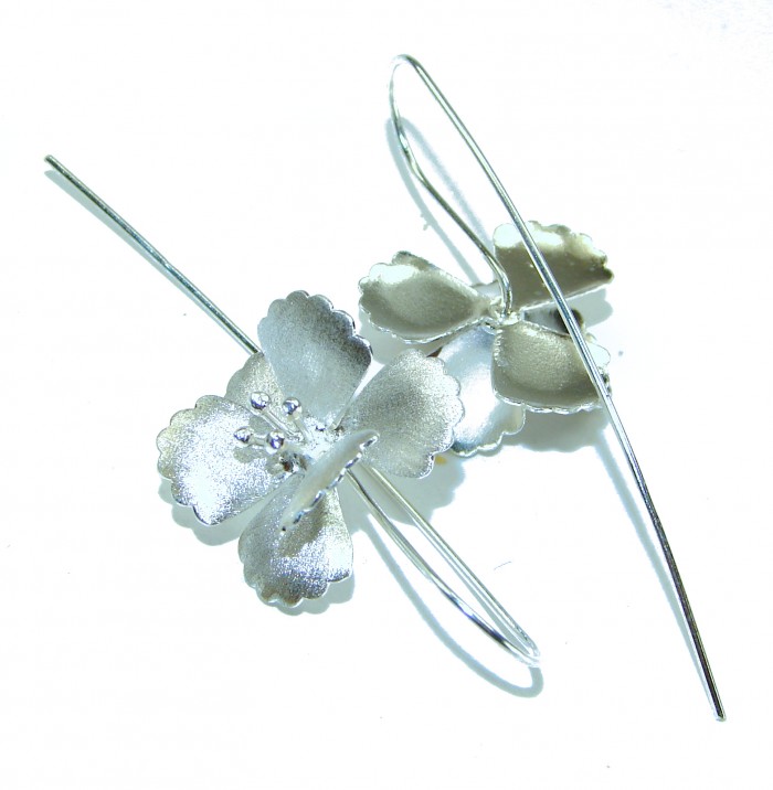 Silver Flowers Italy made .925 Sterling Silver Earrings - Silver flower .925 sterling earrings, top view on white background.
