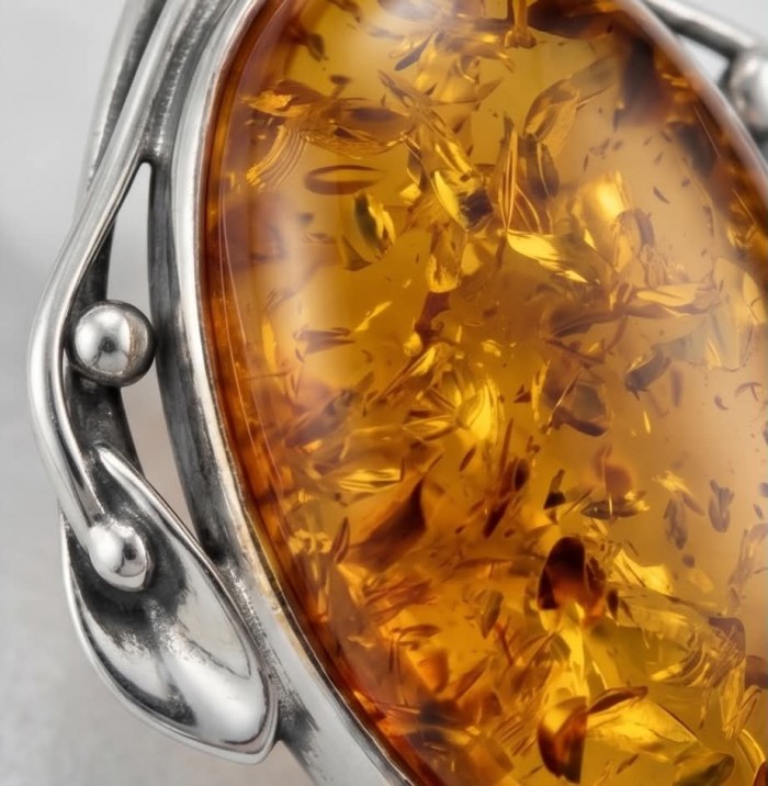 Sea Treasure Prehistoric Authentic Golden Baltic Amber .925 Sterling Silver beautifully handcrafted Pendant - Stone close-up of golden Baltic amber in silver setting.