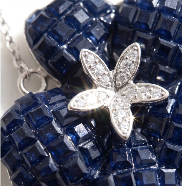 Blue Flower mystery setting 19.2 carat natural Sapphire .925 Sterling Silver Necklace - Close-up of blue sapphire flower with diamond-accented petals