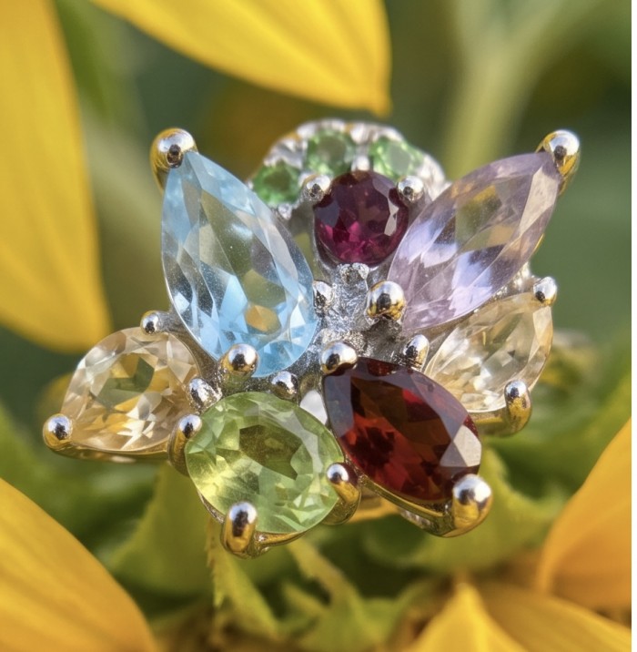 Flower 5.8 carat Multigem rhodium over .925 Sterling Silver Handcrafted Ring size 7 - Close-up of multigem flower ring on a yellow flower background.