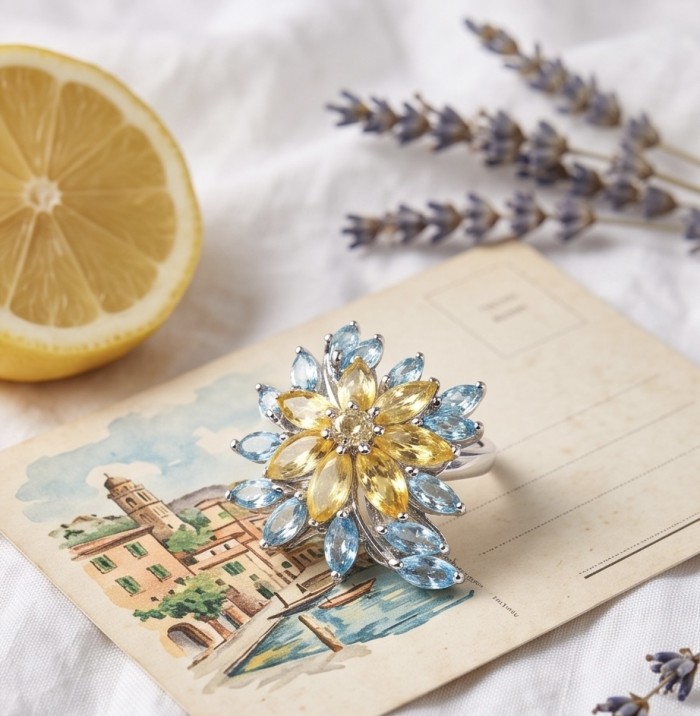 Victoria Authentic 25.5 carat Brazilian Citrine .925 Sterling Silver brilliantly dipped in rhodium handcrafted Statement ring; s. 8 - Floral ring with yellow and blue stones on postcard, top view.