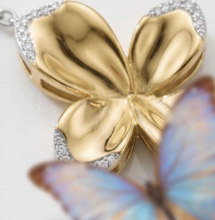 Lotus White Topaz highly polished 18K Gold over .925 Sterling Silver Italy made bracelet - Close-up of 18K gold lotus pendant with diamond accents and a butterfly.