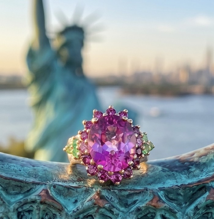 Elizabeth - Natural 10.8 carat pear cut Pink Sapphire .925 Sterling Silver dipped in 22K Rose Gold handmade Statement Ring size 6 - Close-up of pink sapphire ring with Statue of Liberty background