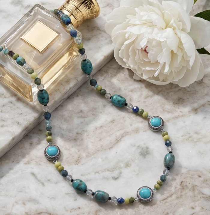 Boho Style - Great quality Turquoise .925 Sterling Silver handcrafted Necklace - Turquoise necklace on marble near perfume bottle and white flower.