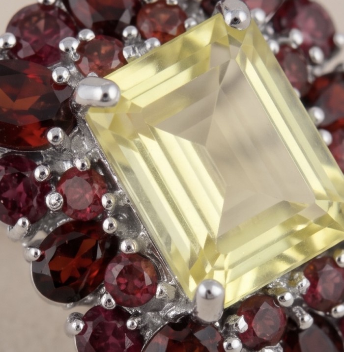 Costa del Sol 17.8 carat Genuine Lemon Quartz rhodium over .925 Sterling Silver handcrafted Earrings - Close-up of Costa del Sol Lemon Quartz ring with red stone accents.